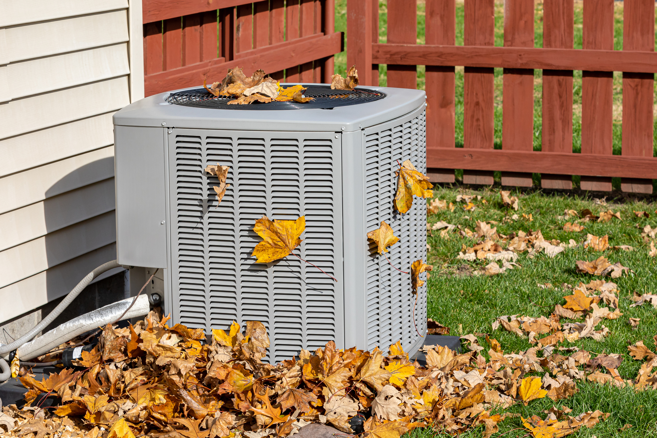 ac unit with leaves